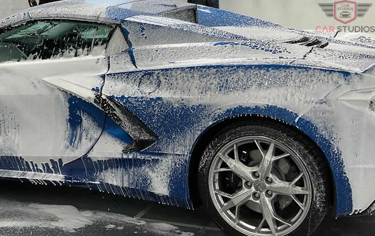 Blue 2022 C9 Corvette washing
